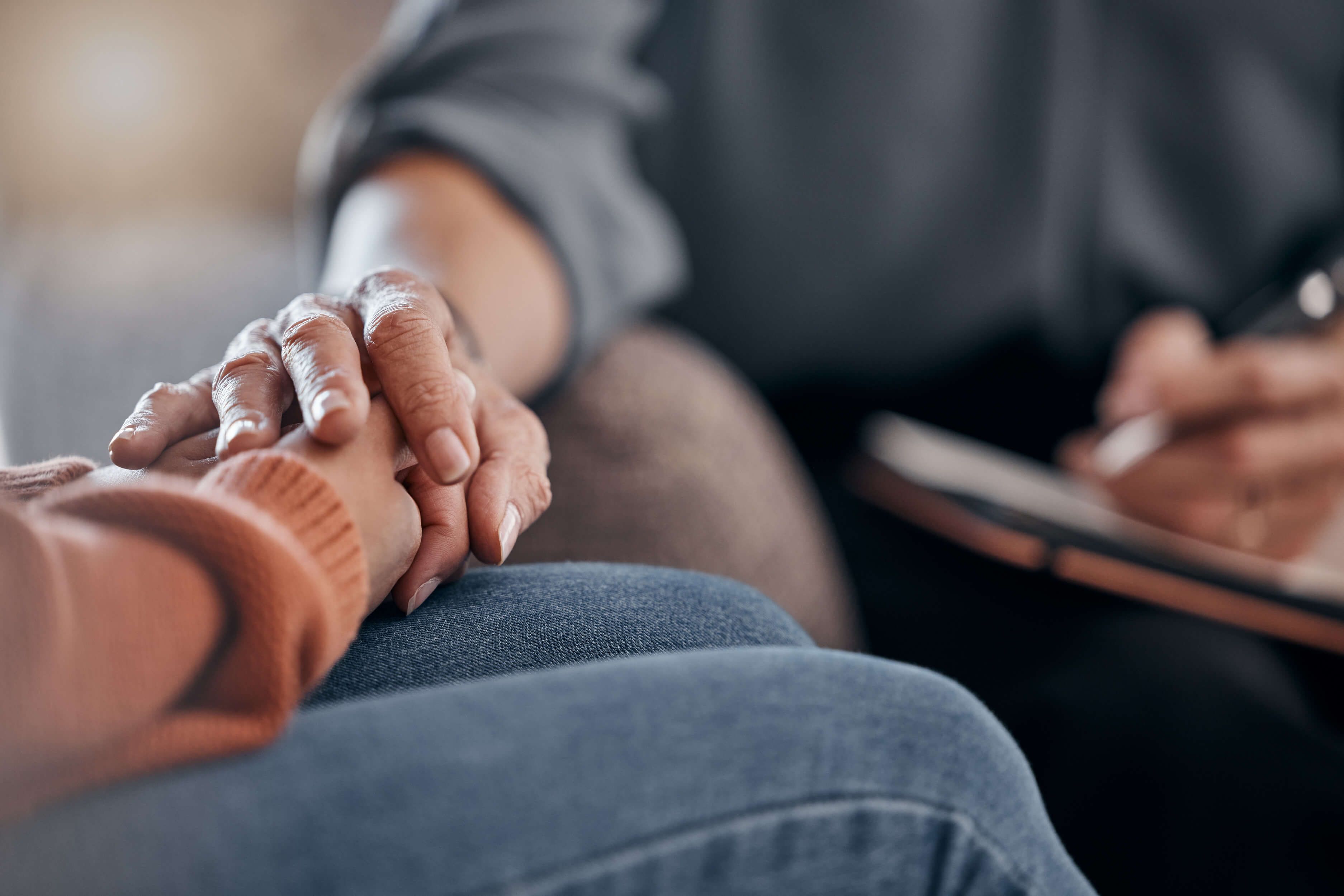 Two people holding hands