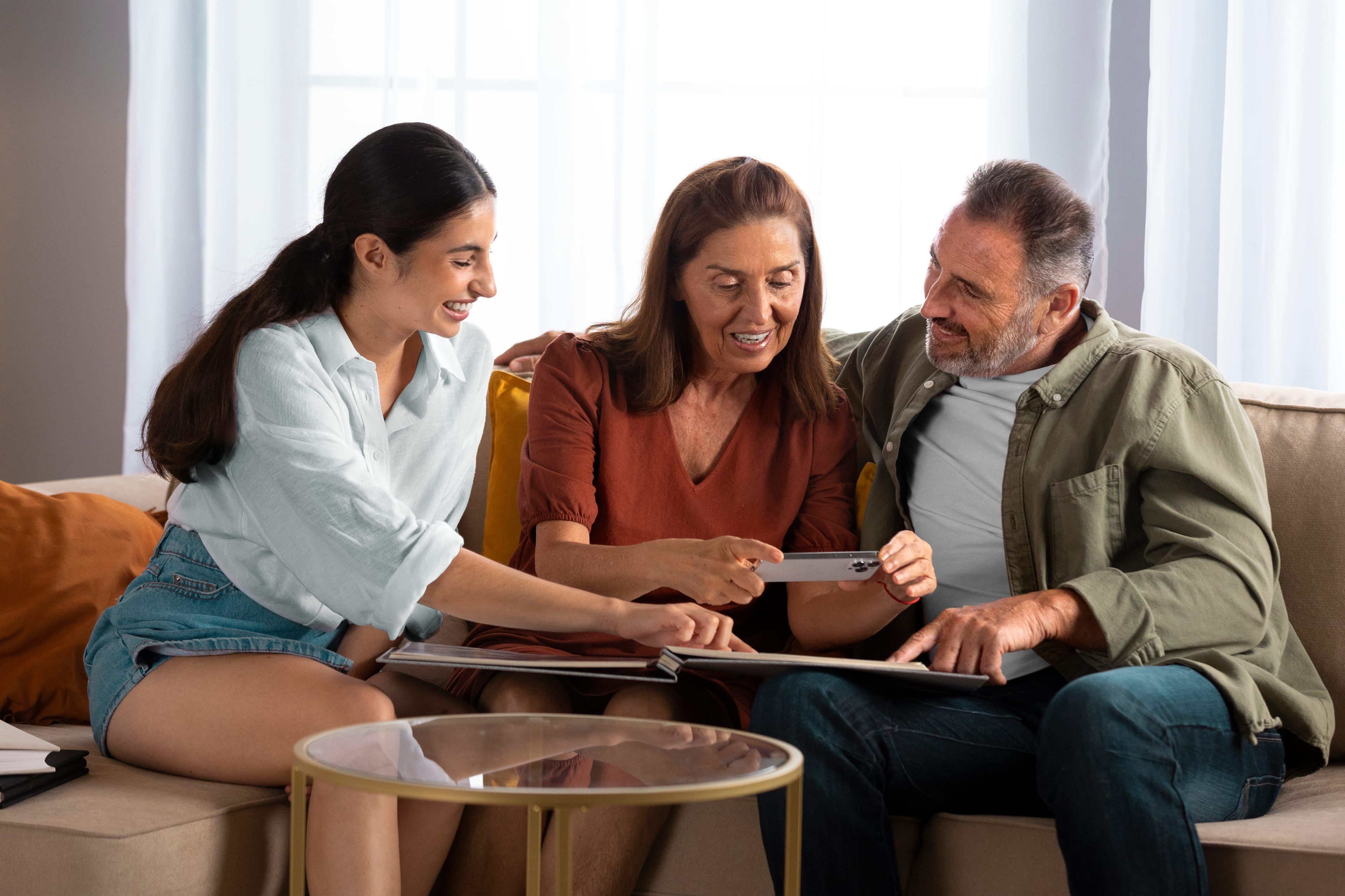Two people with a therapist around a table