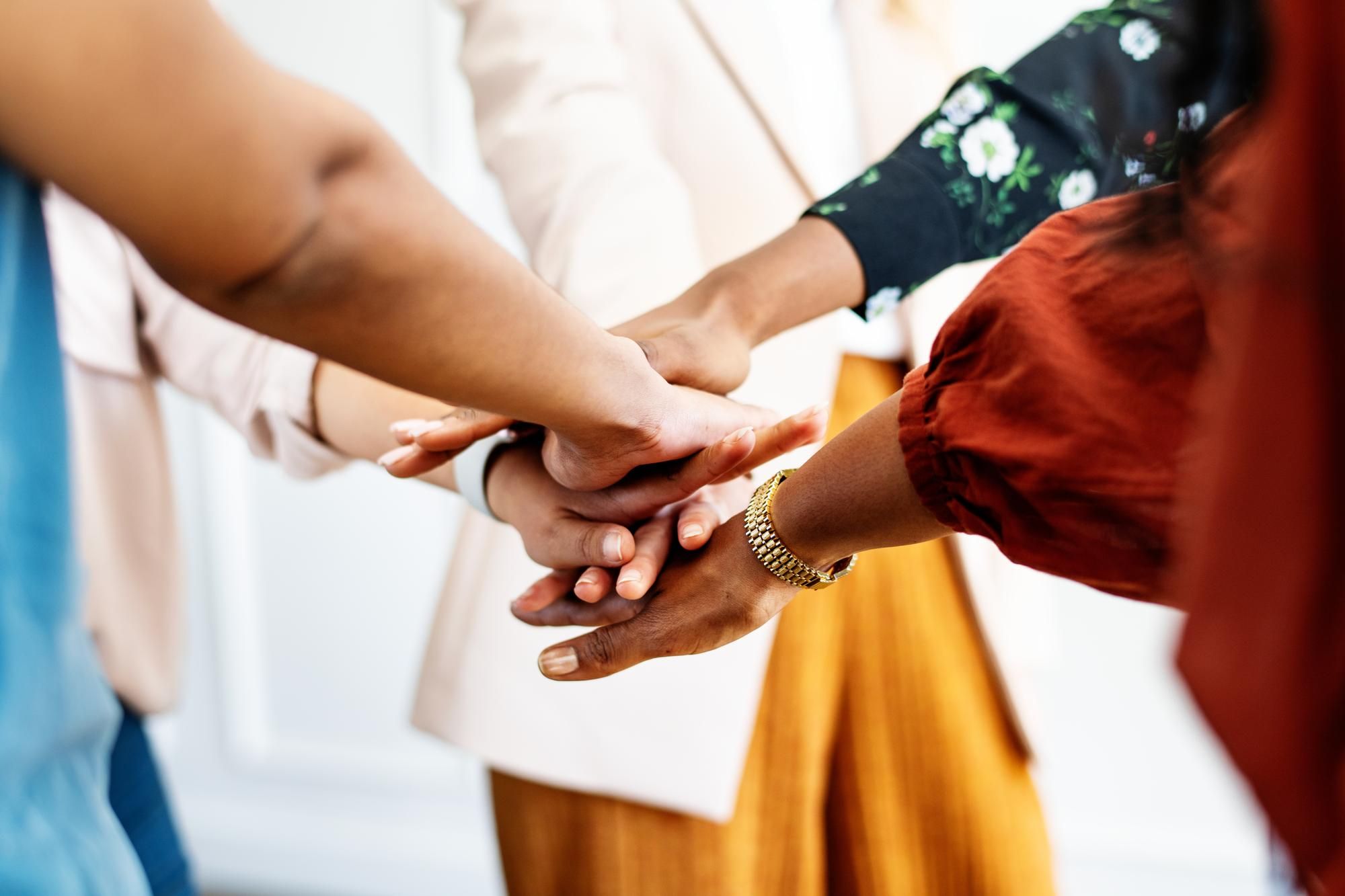 People putting their hands together