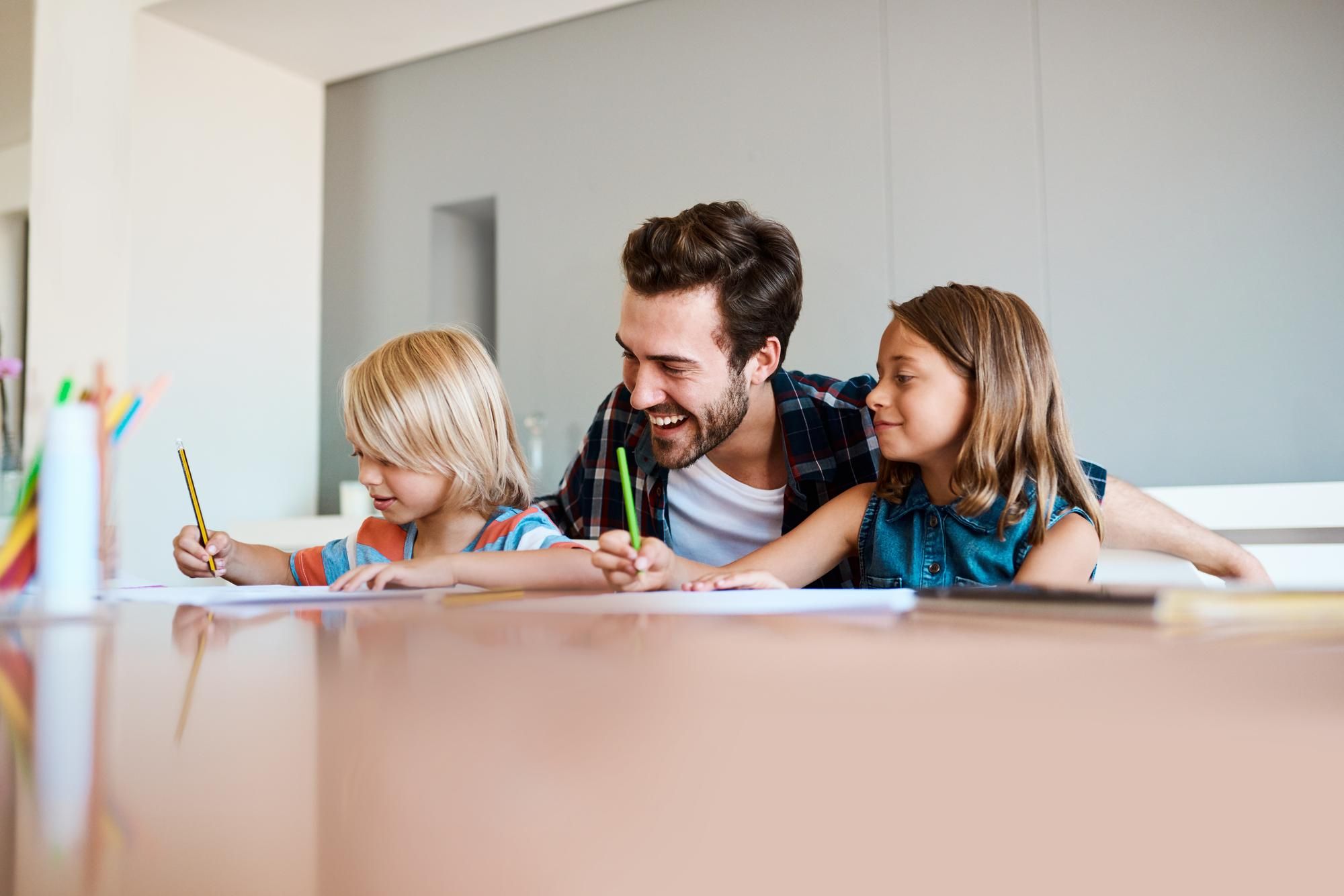 Parent and children coloring together