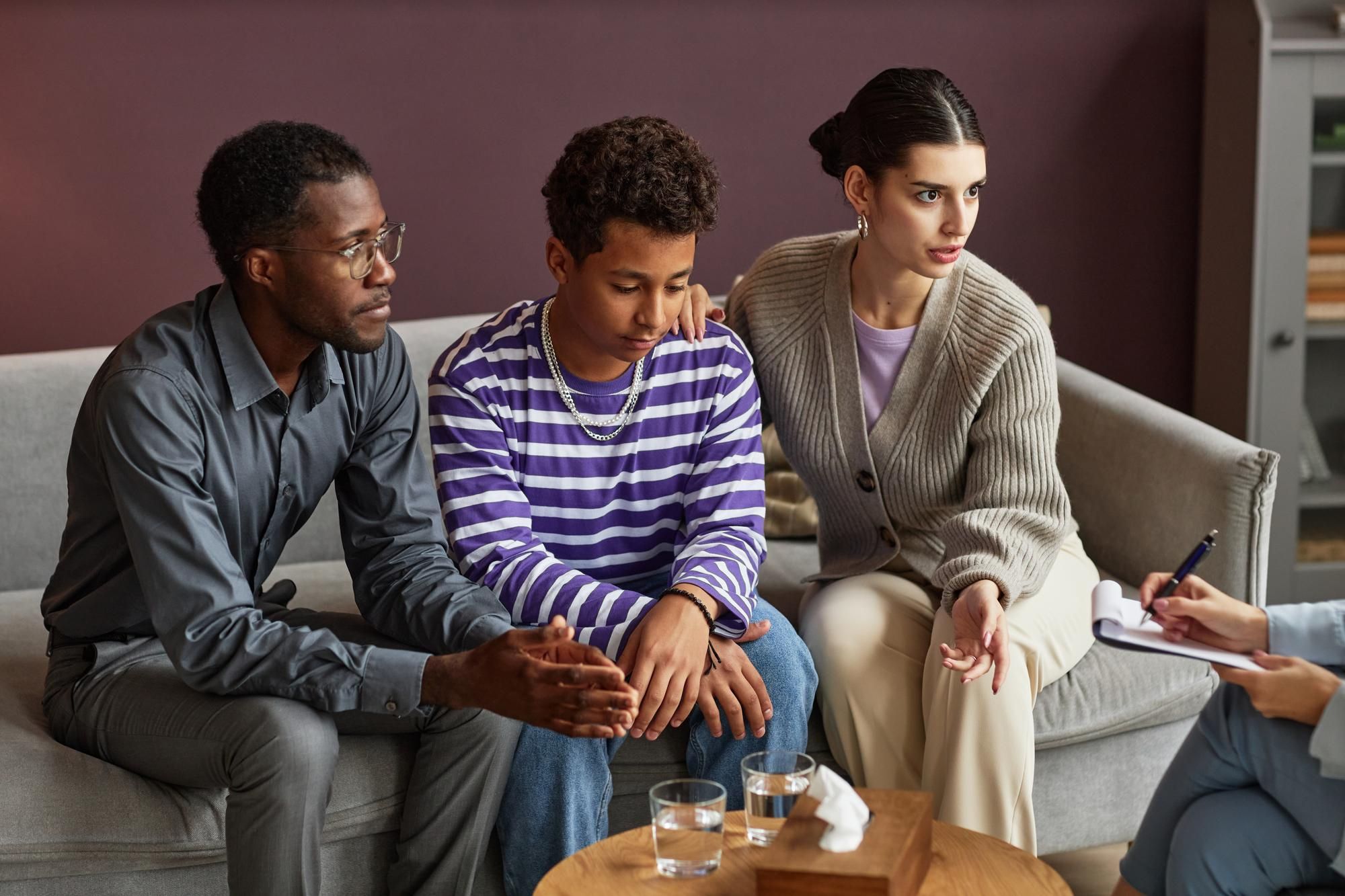 Youth with parents sitting together